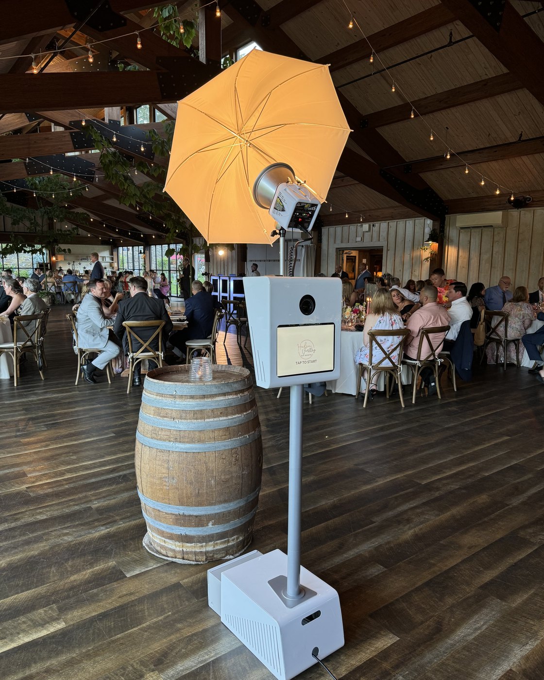 The photo booth set up under its umbrella light at a Hudson Valley venue