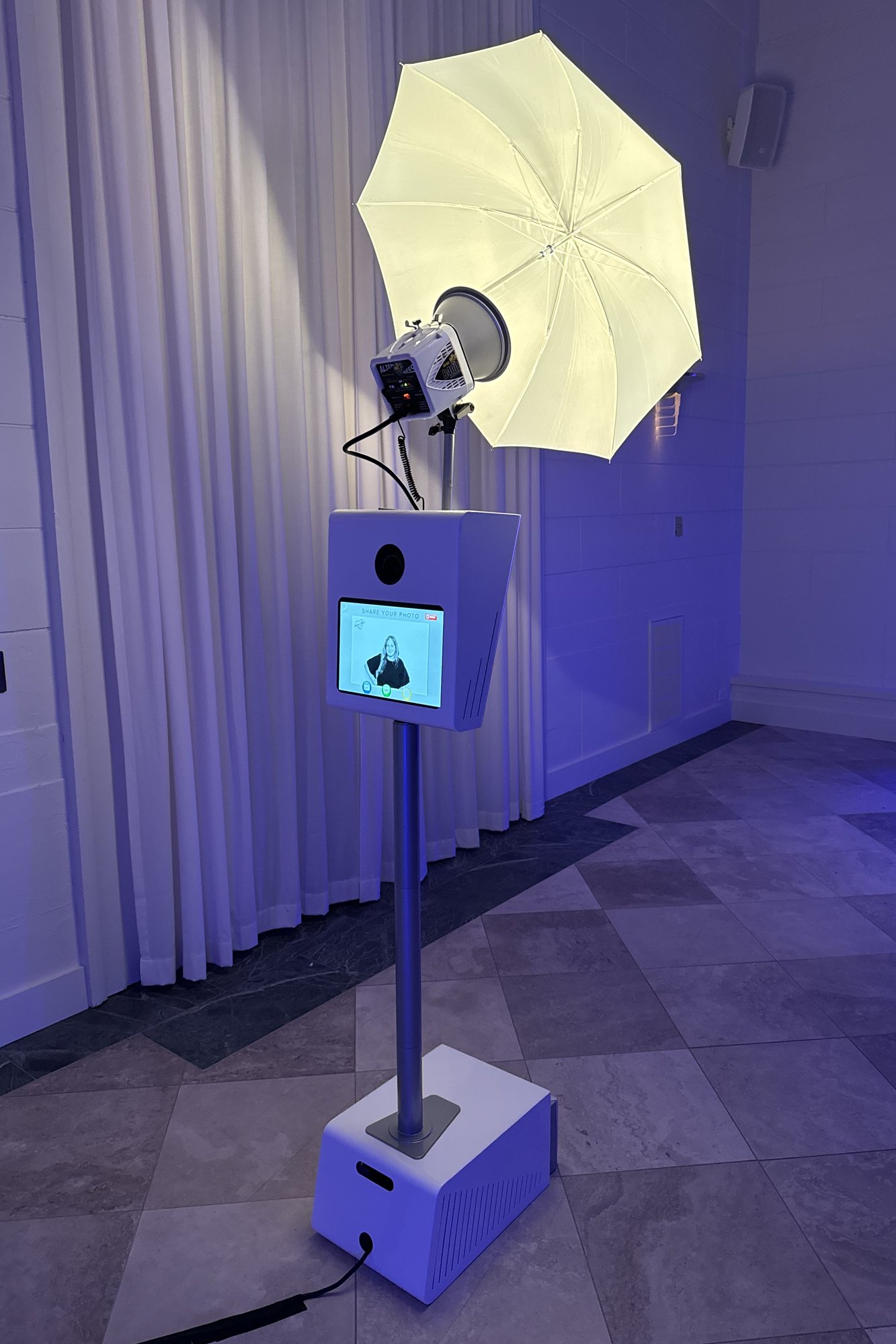 The booth set up under colored uplighting